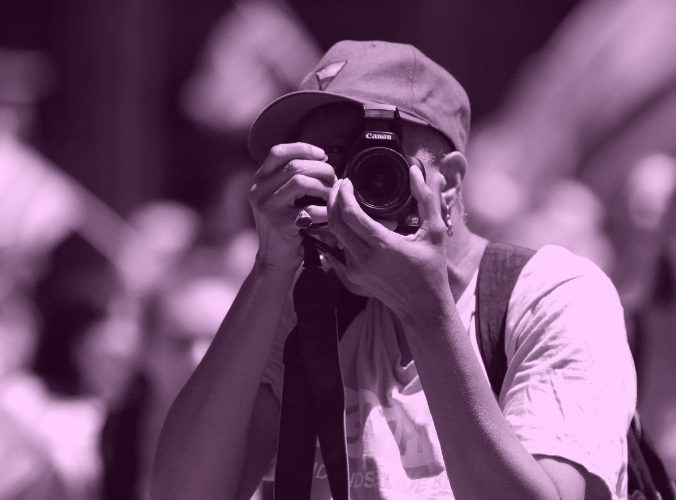 A vibrant image of a photographer at a pride parade
